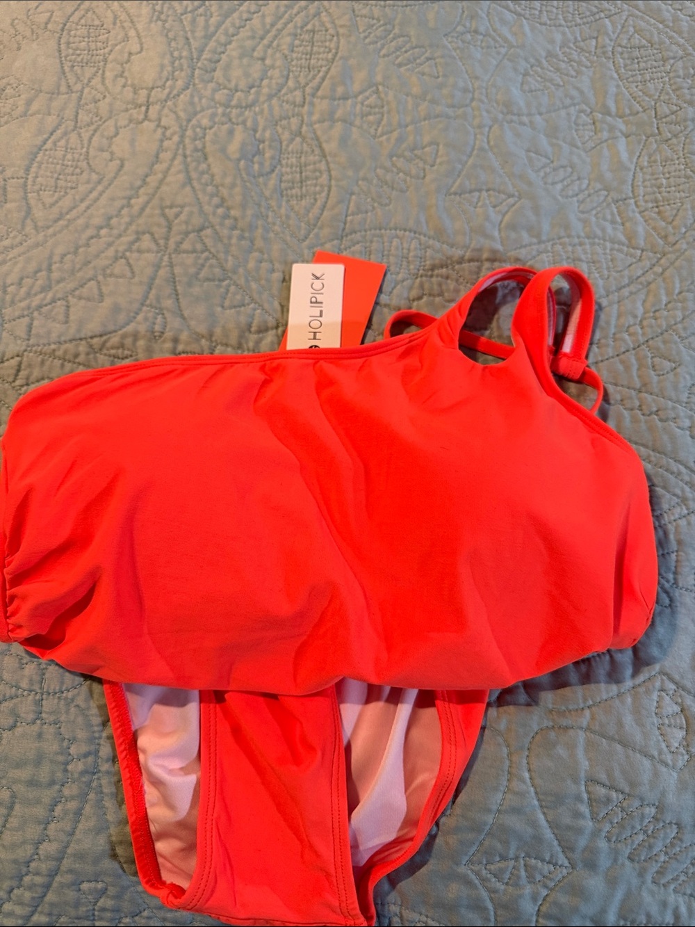 NWT Women’s bright coral one piece, one shoulder swim suit.